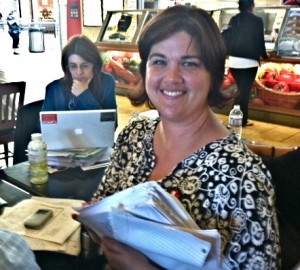 English teacher Jennifer Thomas grading papers at the mall 